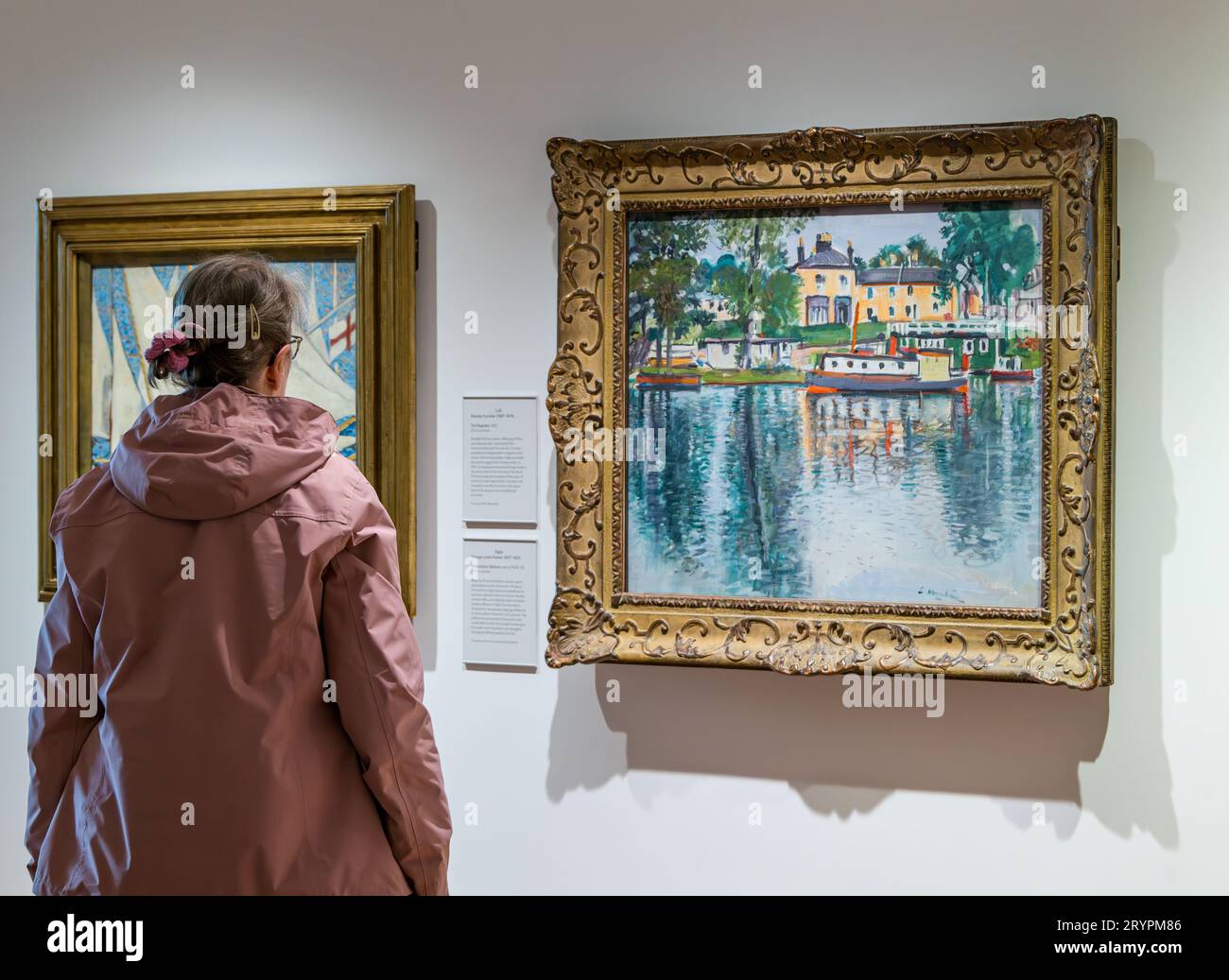 A visitor admiring paintings at National Galleries of Scotland new extension, Edinburgh, UK Stock Photo