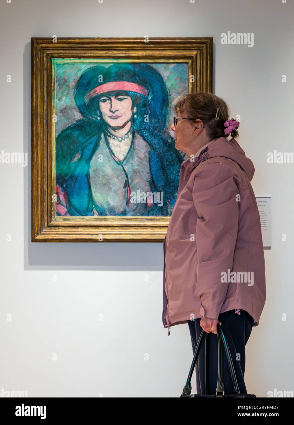 A visitor admiring a painting at National Galleries of Scotland newly opened extension, Edinburgh, UK Stock Photo