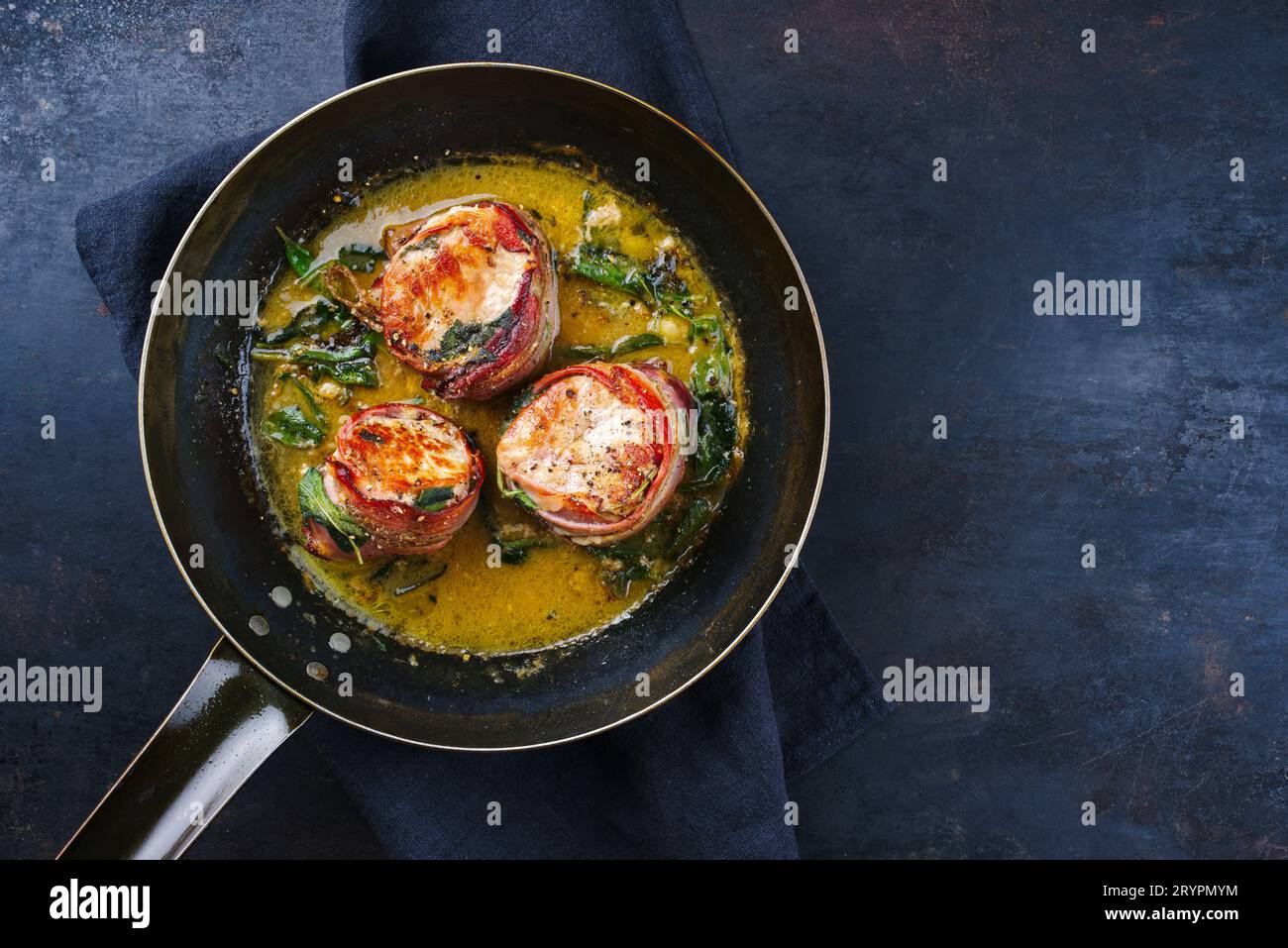 Traditional roasted veal filet medallions with bacon coating and sage
