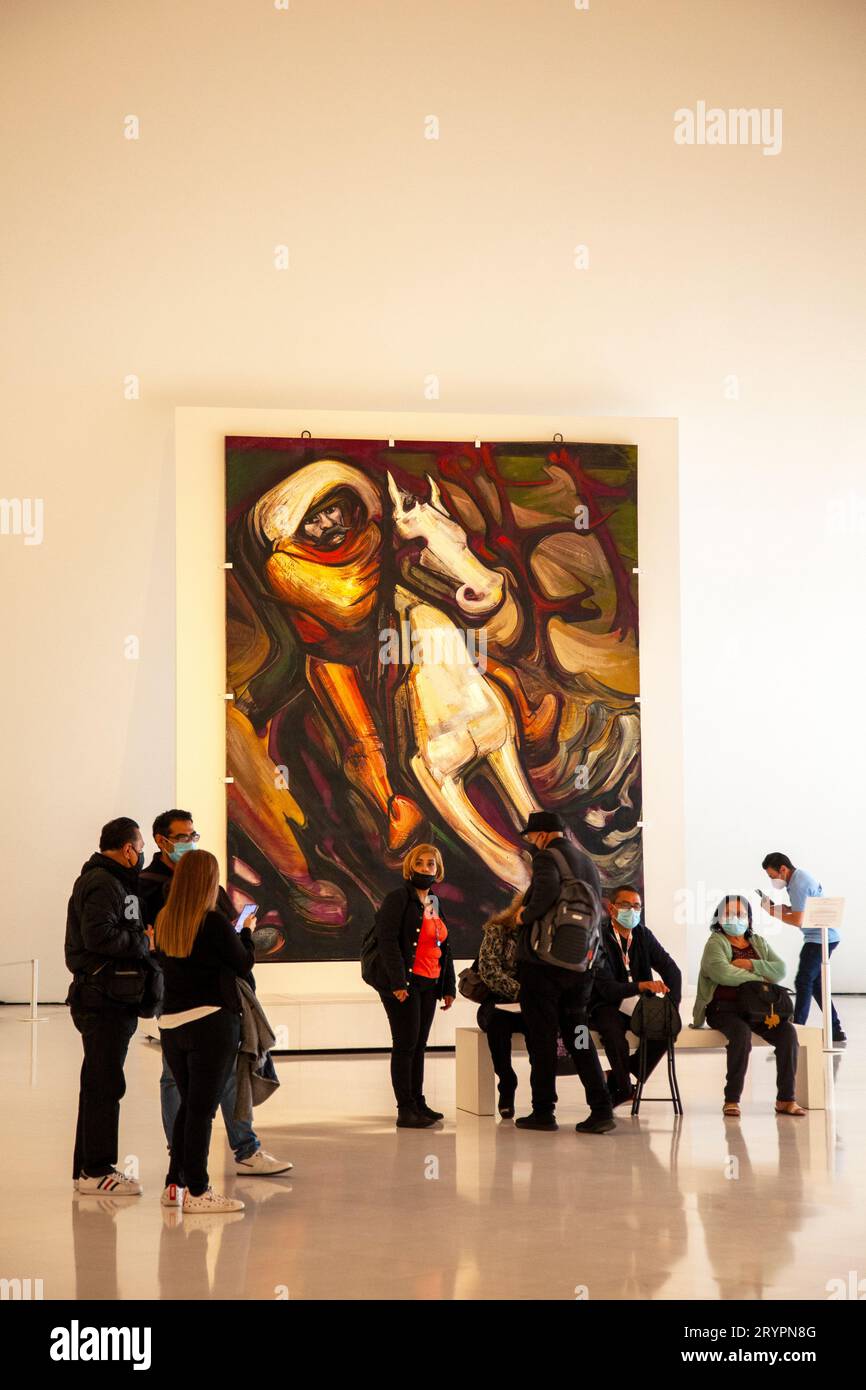 Inside Museo Soumaya - Visitors seated in front of Painting of Mexican Revolutionary Zapata by David Alfaro Siqueiros  - Mexico City, Mexico Stock Photo