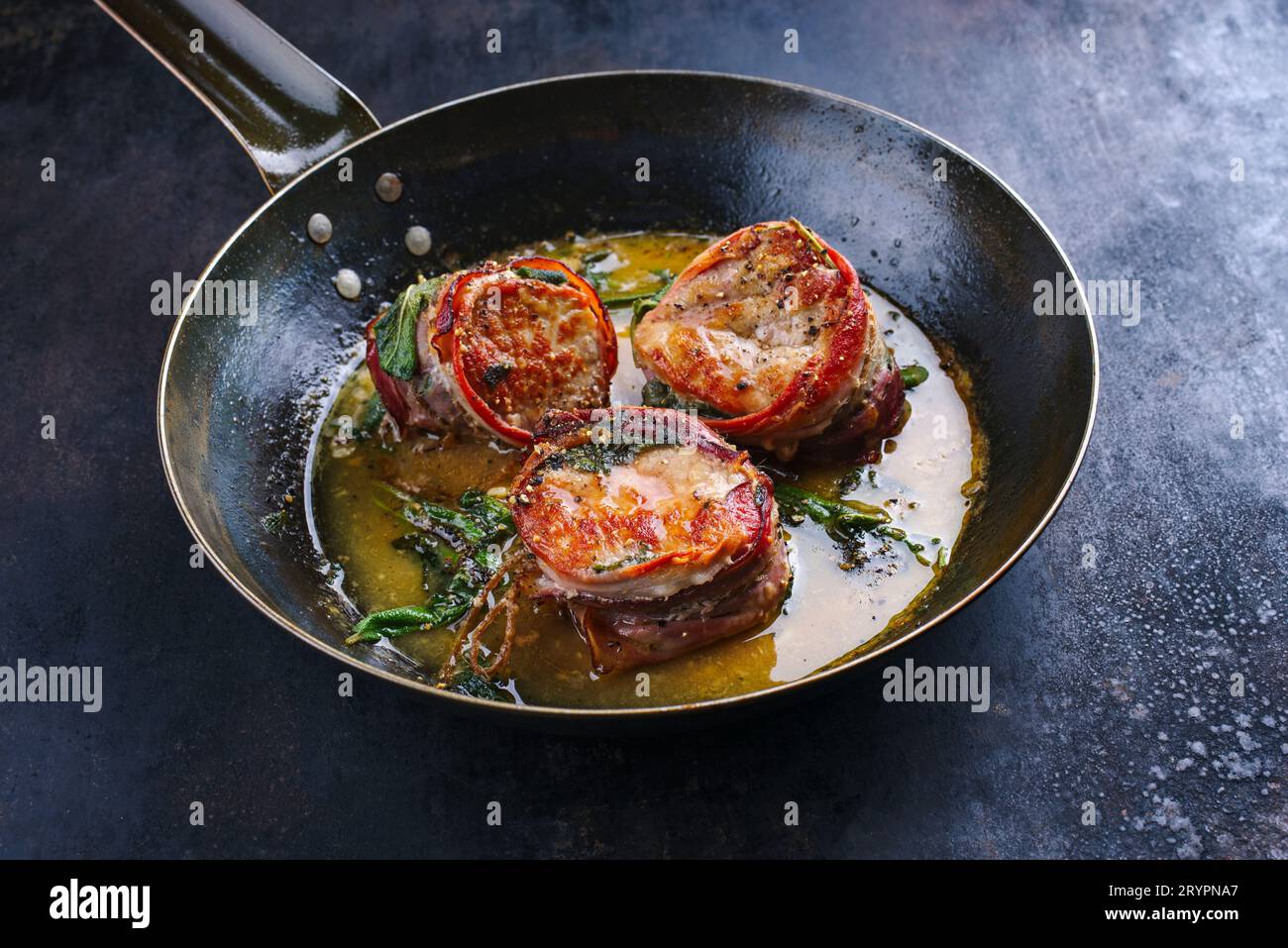 Traditional roasted veal filet medallions with bacon coating and sage