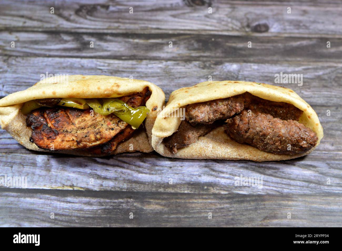 Sandwiches of beef Kofta and tarb kofta shish, minced meat wrapped in lamb fat charcoal grilled