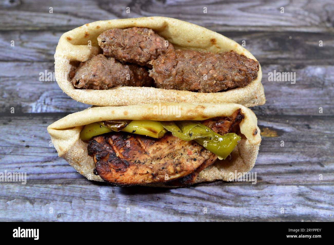 Sandwiches of beef Kofta and tarb kofta shish, minced meat wrapped in lamb fat charcoal grilled