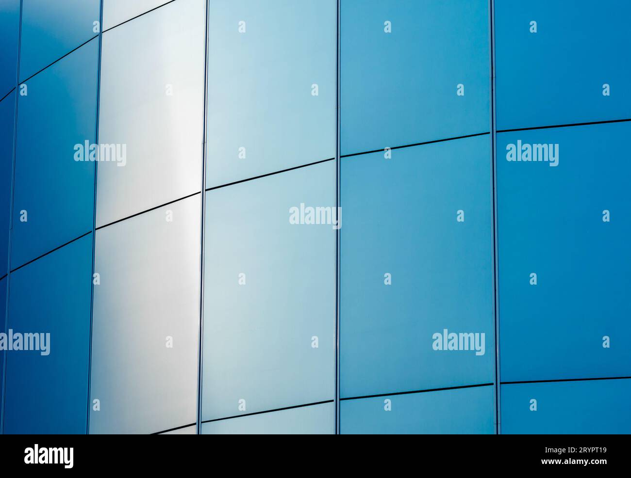 Wall of the building with blue panels Stock Photo