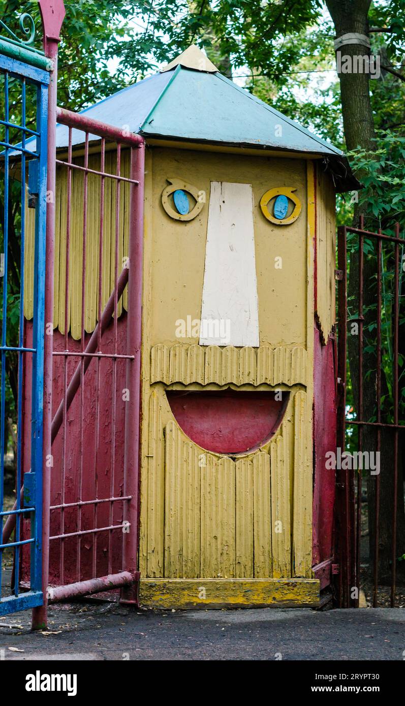 Facade of the building with the image of the face of a fairy-tale character in an amusement park Stock Photo