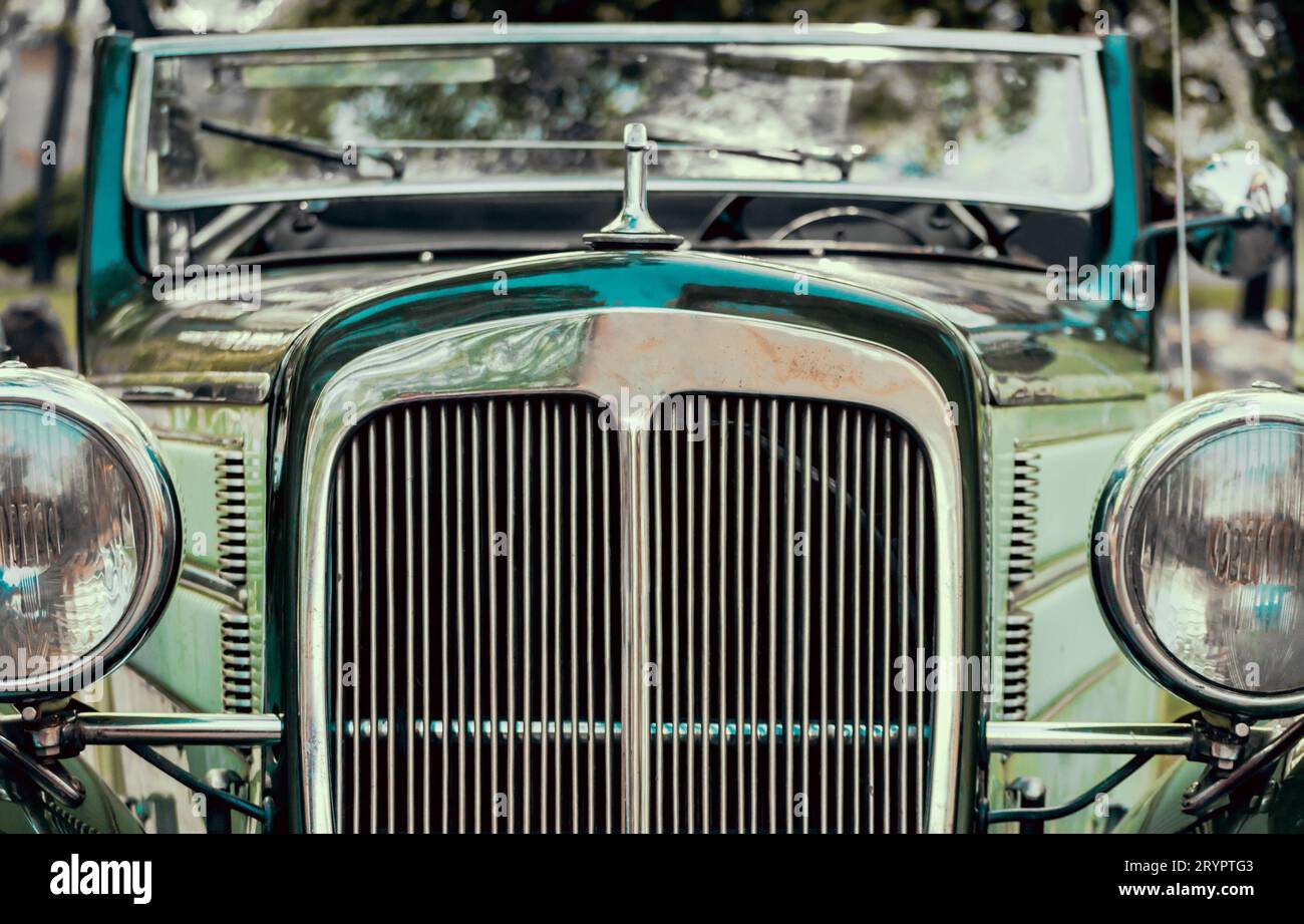 Headlights and radiator of green old retro car close up Stock Photo