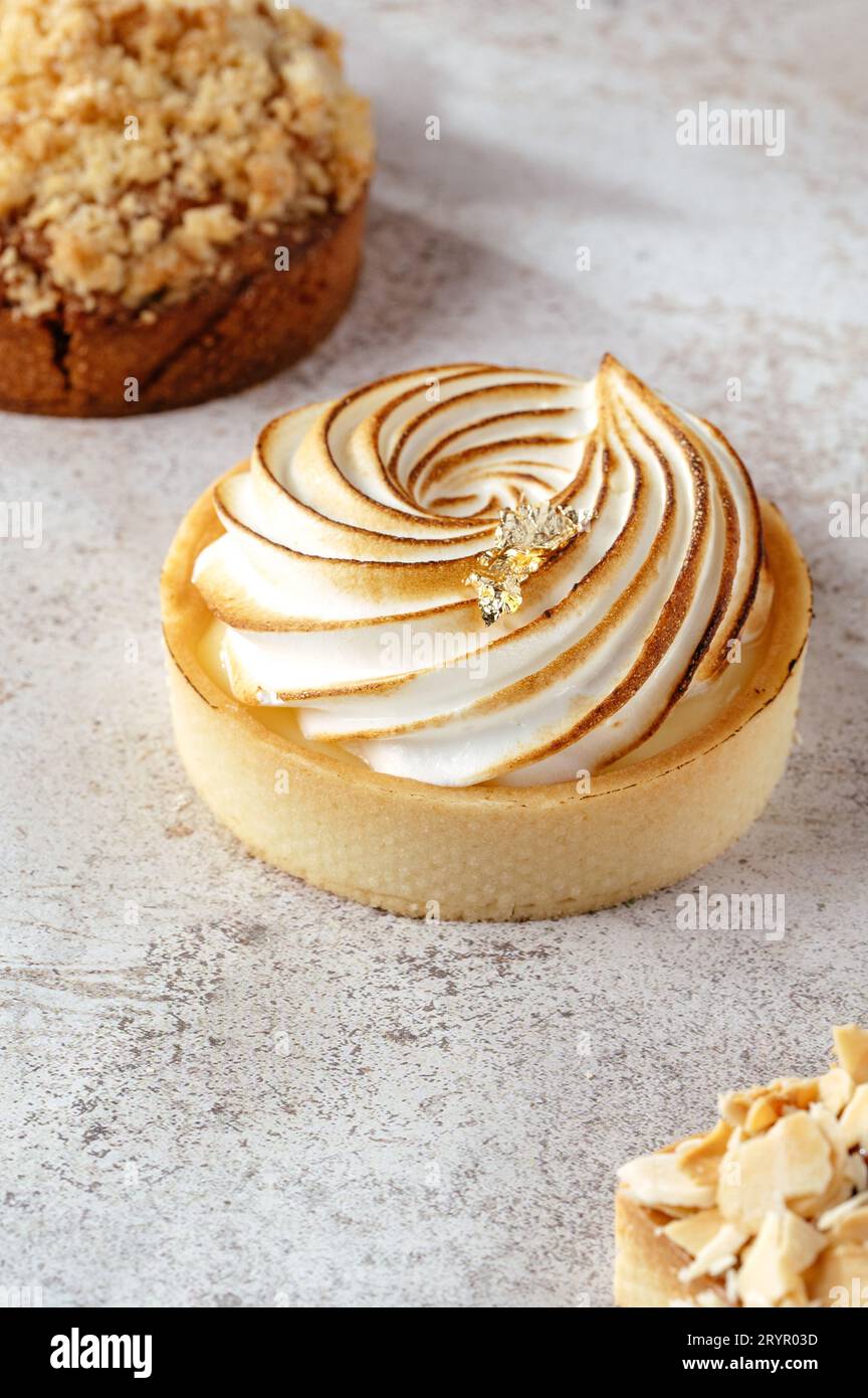 Lemon meringue tart on grey background Stock Photo