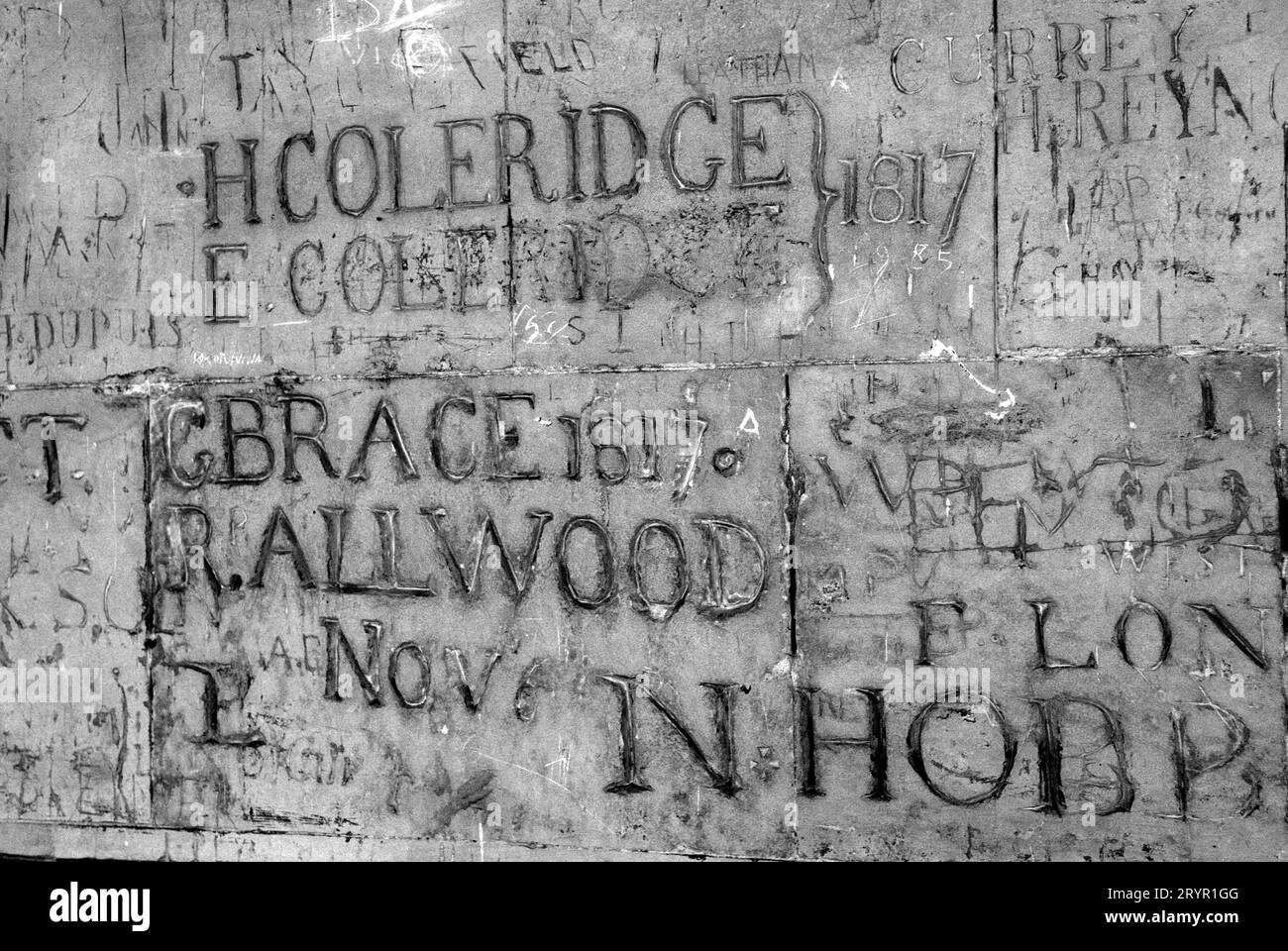H Coleridge E Coleridge and other boys surnames, past pupils of Eton College - Old Etonians -  OE's carved on a stone wall of the Cloisters at Eton School. Windsor England 2000s 2006  UK HOMER SYKES Stock Photo