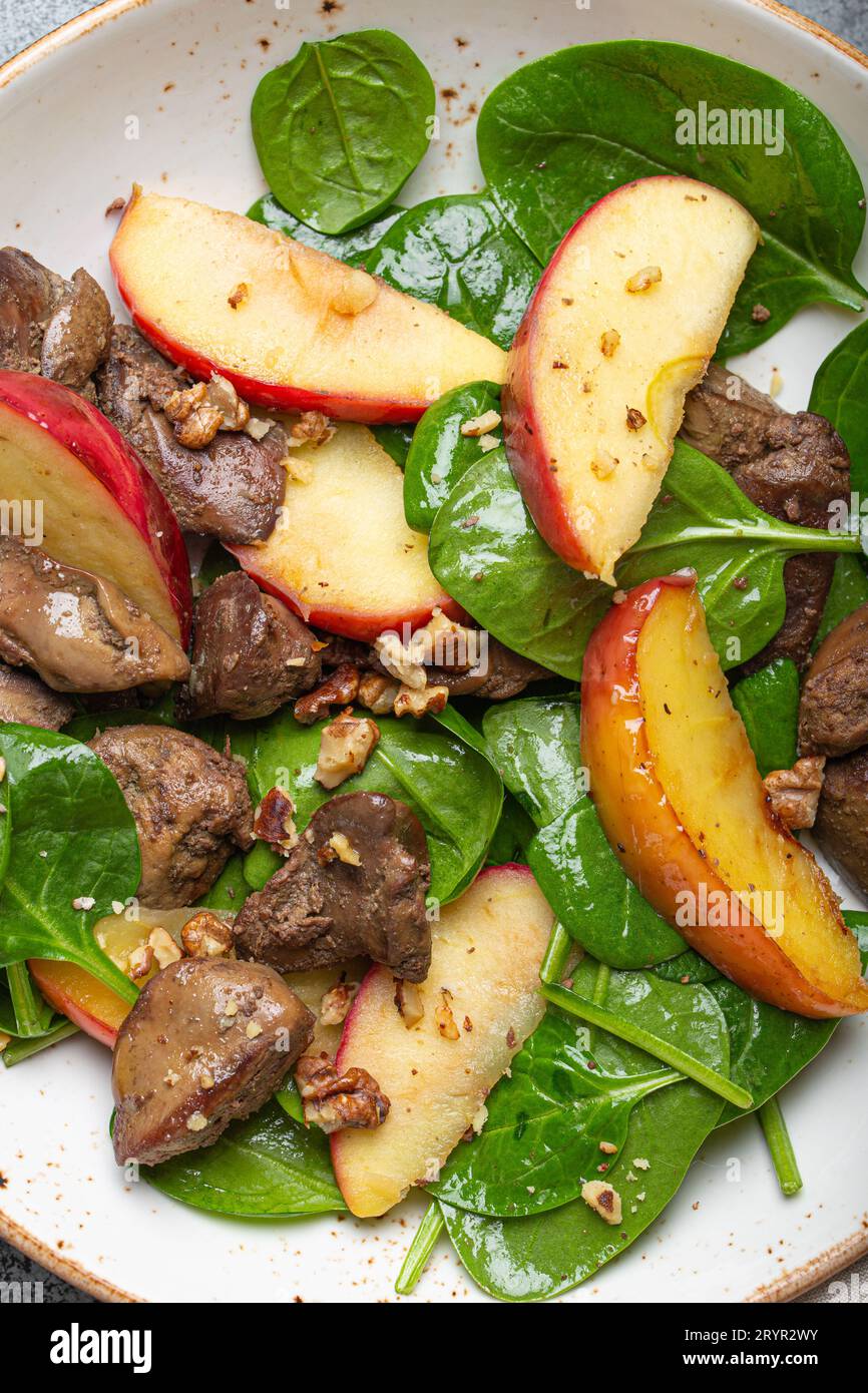 Close Up of Healthy Salad with Iron Rich Ingredients Chicken Liver, Apples, Fresh Spinach and