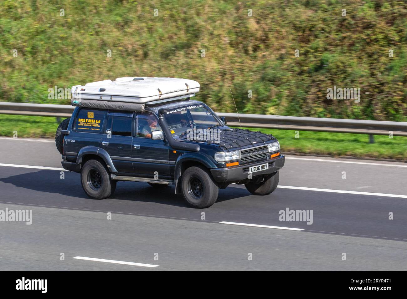 Rock & Road Turbo 4x4 1993 90s nineties Toyota Land Cruiser travelling at speed on the M6 motorway in Greater Manchester, UK Stock Photo