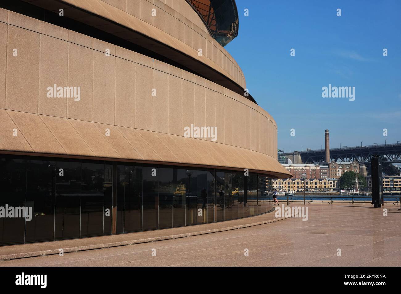 Morning on the Northern Broadwalk of the Sydney Opera House looking across to Campbells Cove, and old maritime warehouses in the The Rocks Stock Photo