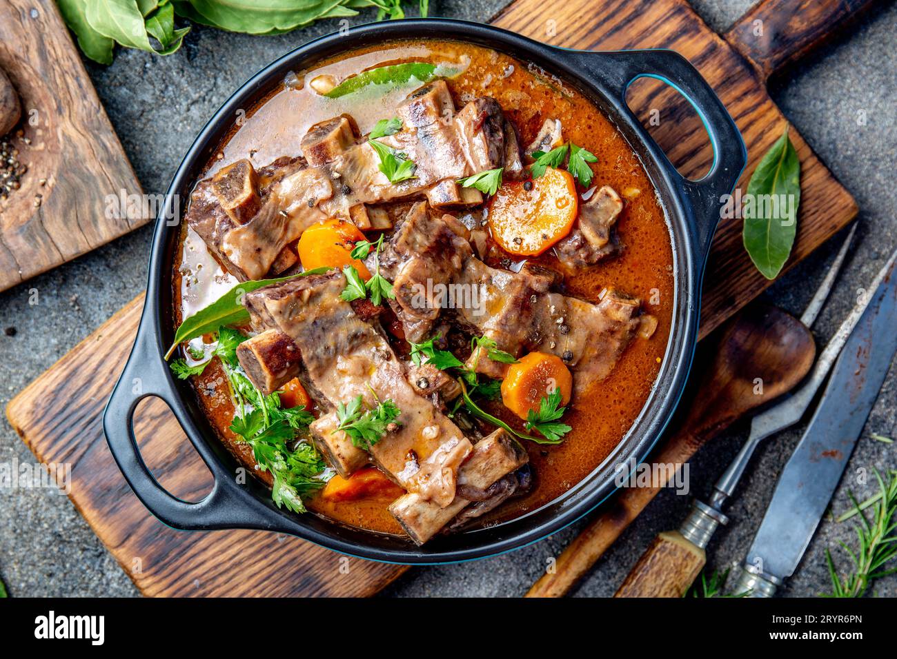 Beef ribs Bourguignon. Beef ribs stewed with carrot, onion in red wine. France dish Stock Photo