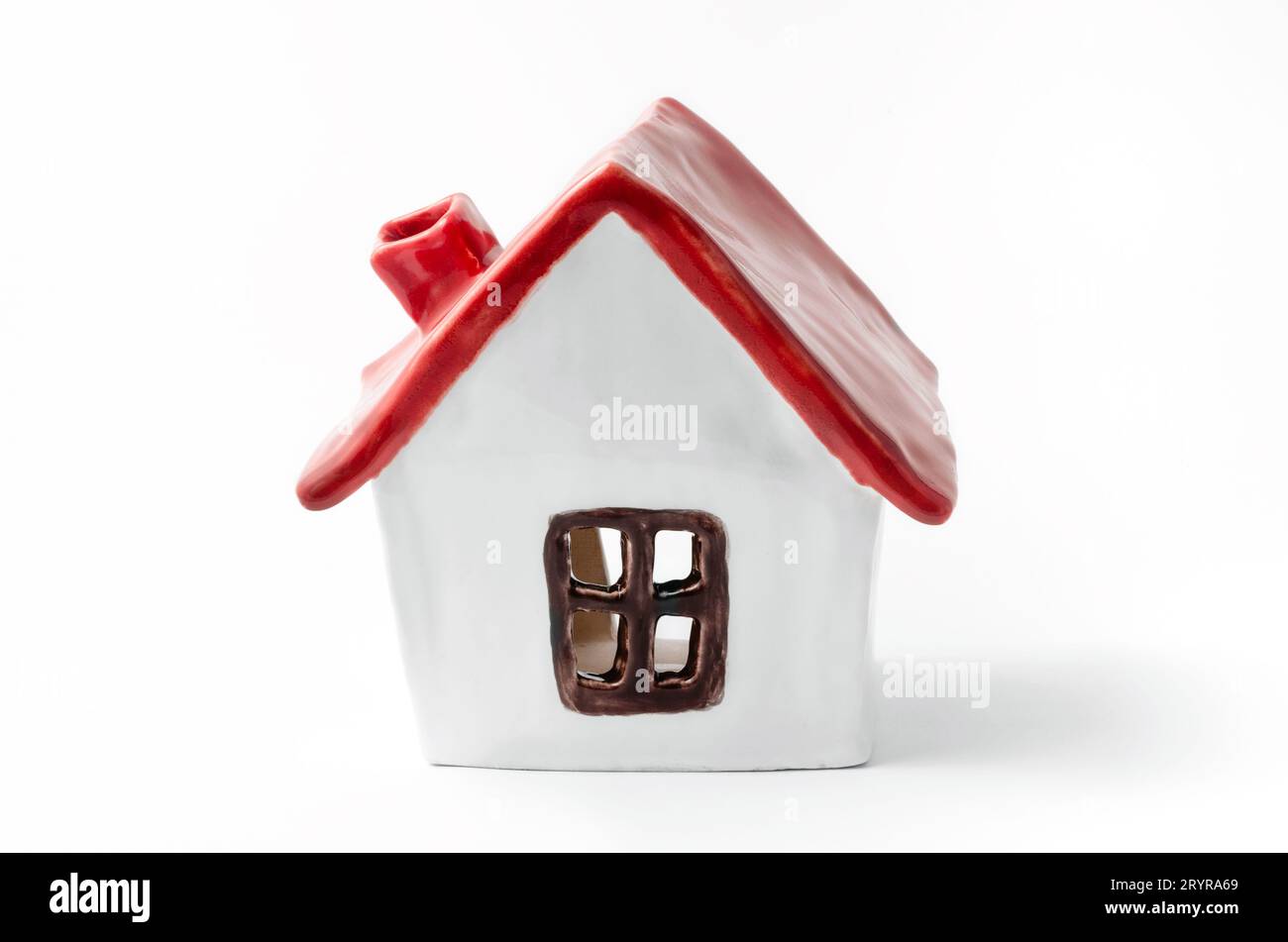 Small white porcelain house with a red roof handmade Stock Photo