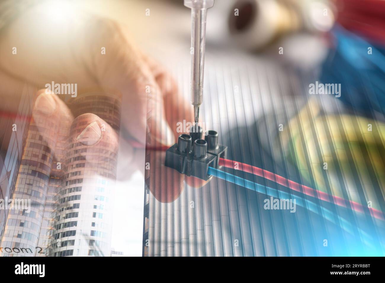 Electrician hands connecting wires in terminal block; multiple exposure Stock Photo