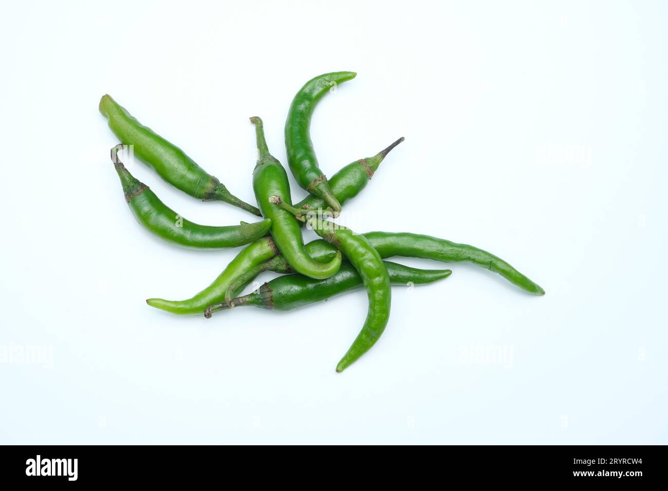 green chili peppers isolated on a white background Stock Photo - Alamy