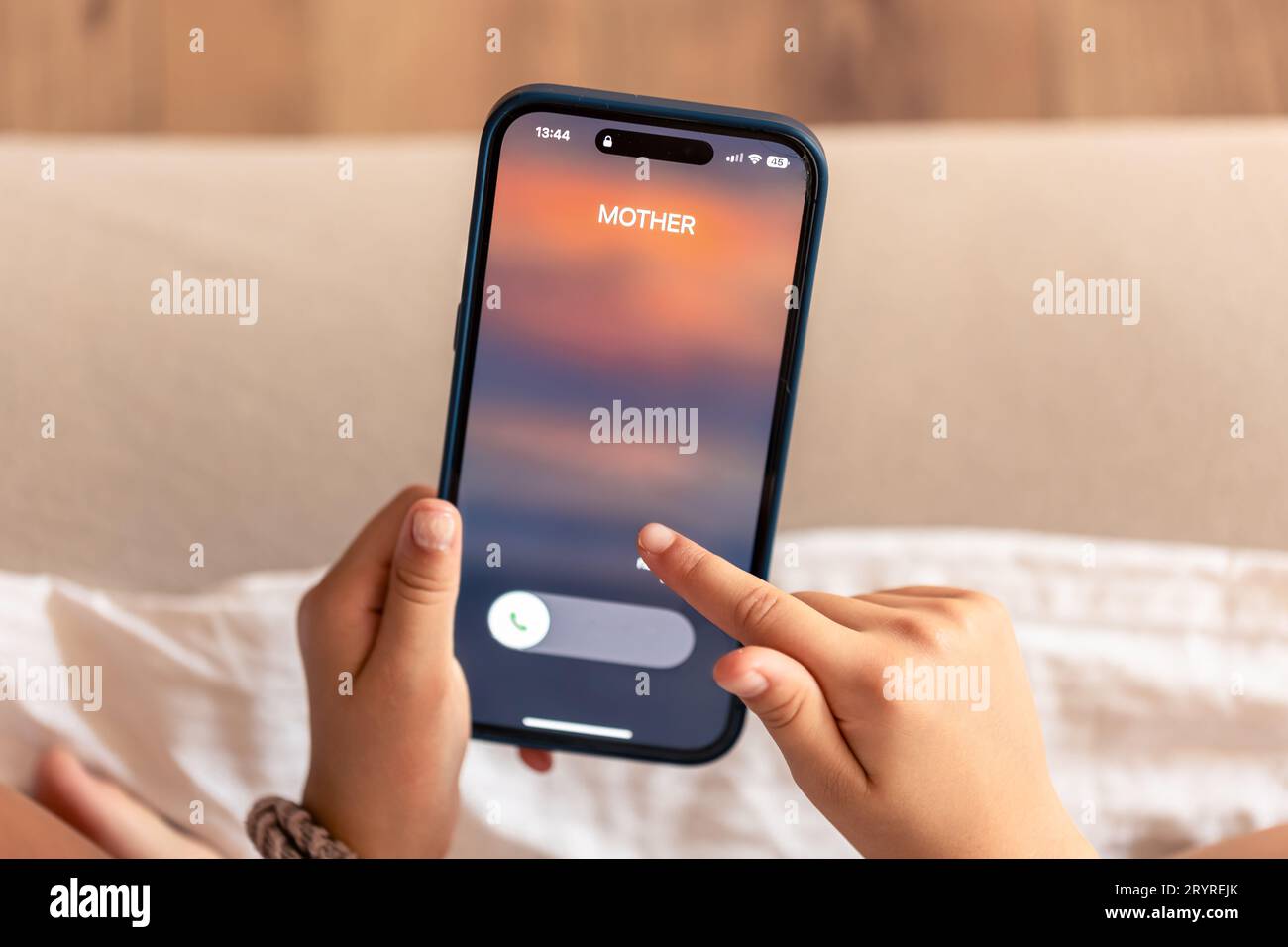 Smartphone in child hands with Incoming mother call on a screen Stock ...