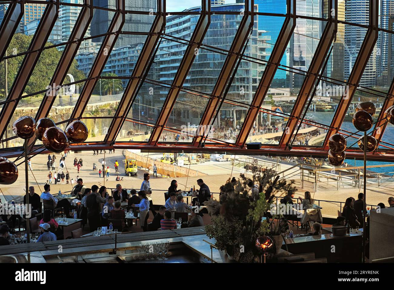 Sydney Opera House Interior at Bennelong Restaurant looking across the restaurant out to the forecourt, Circular Quay and Sydney CBD Stock Photo