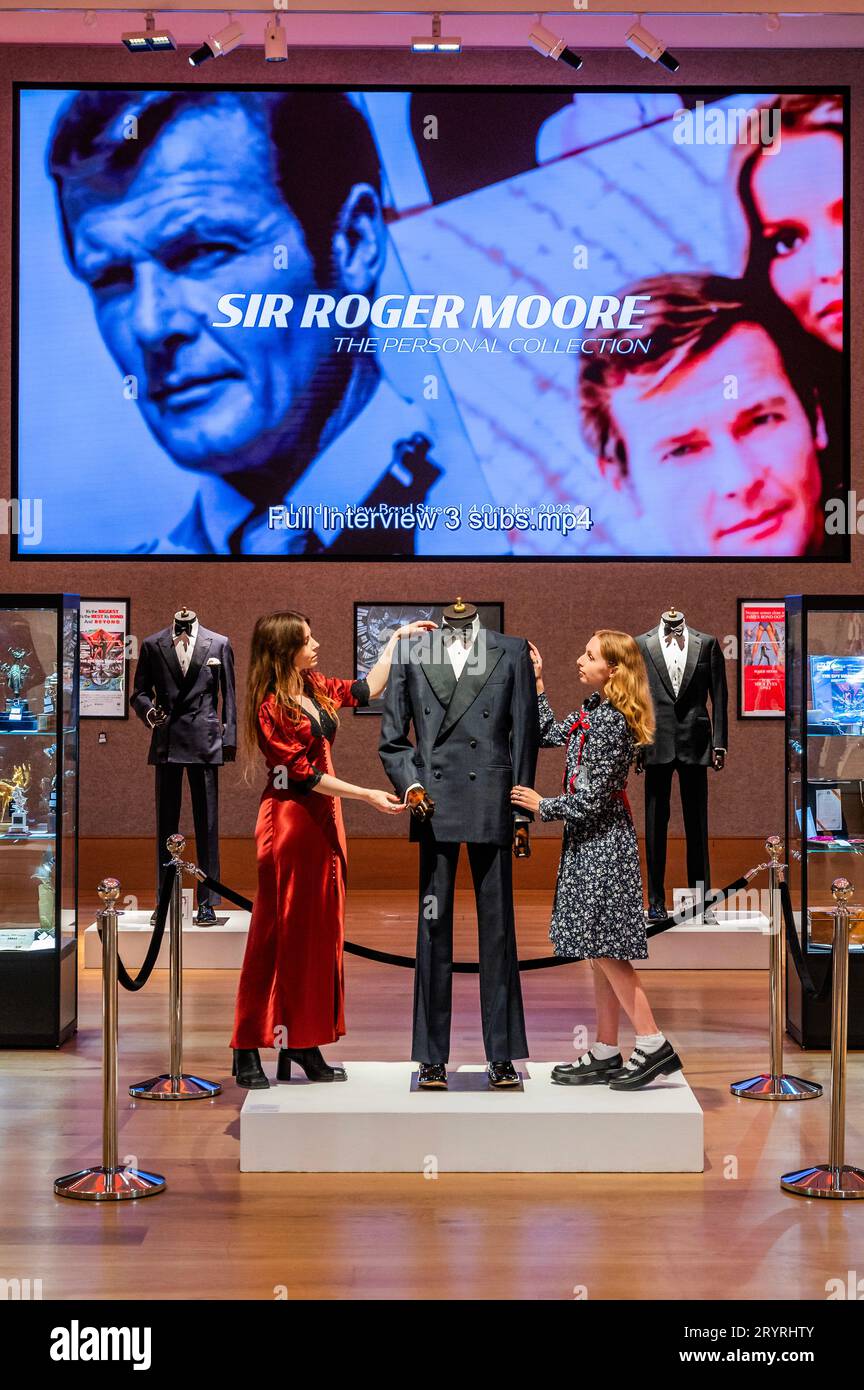 London, UK. 2nd Oct, 2023. A Douglas Hayward double-breasted mohair dinner suit made for Sir Roger Moore in A View To A Kill, 1985, est £20,000 - £30,000 with anothert reputedly by Angelo Roma and believed to have been made for Sir Roger Moore in The Spy Who Loved Me, 1977, est £20,000 - £30,000 - Sir Roger Moore: The Personal Collection at Bonhams New Bond Street, London. On 4 October, 180 lots will be auctioned, marking the 50th anniversary year of his first appearance as 007. Credit: Guy Bell/Alamy Live News Stock Photo