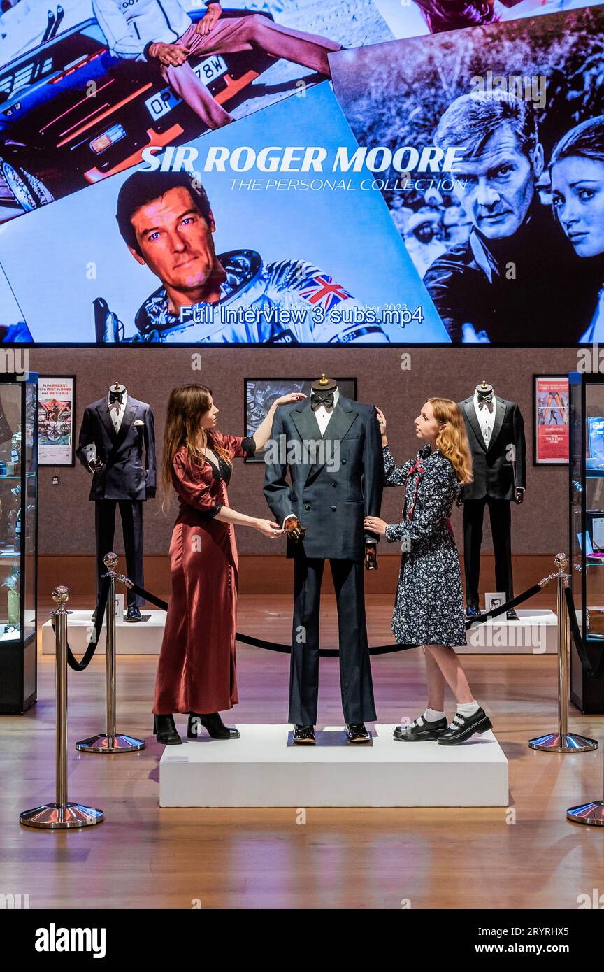 London, UK. 2nd Oct, 2023. A Douglas Hayward double-breasted mohair dinner suit made for Sir Roger Moore in A View To A Kill, 1985, est £20,000 - £30,000 with anothert reputedly by Angelo Roma and believed to have been made for Sir Roger Moore in The Spy Who Loved Me, 1977, est £20,000 - £30,000 - Sir Roger Moore: The Personal Collection at Bonhams New Bond Street, London. On 4 October, 180 lots will be auctioned, marking the 50th anniversary year of his first appearance as 007. Credit: Guy Bell/Alamy Live News Stock Photo