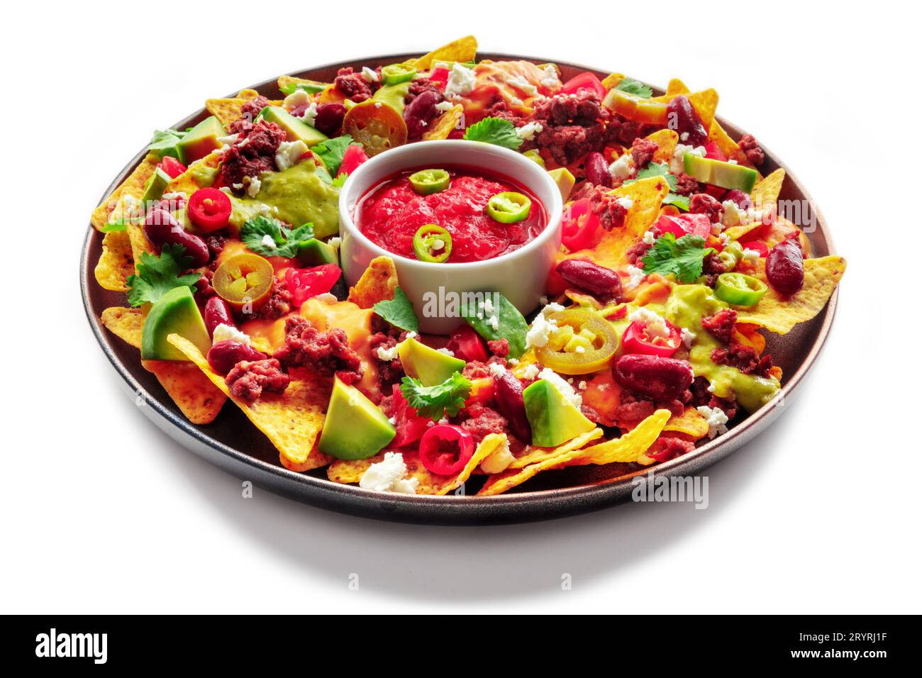Loaded nachos. Mexican nacho chips with beef, guacamole sauce, cheese ...