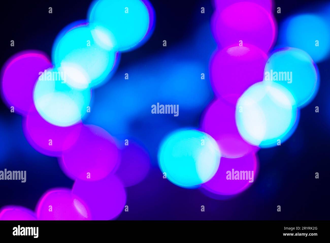 Duotone blue and purple abstraction of blurry neon lights on black Stock Photo