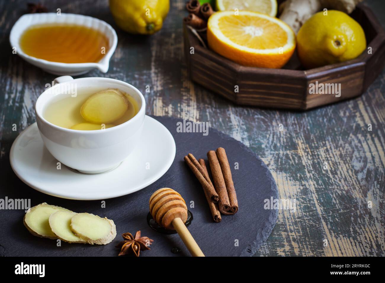 Ginger hot  immunity boosting Vitamin natural drink With citrus, honey and cinnamon and ingredients Stock Photo