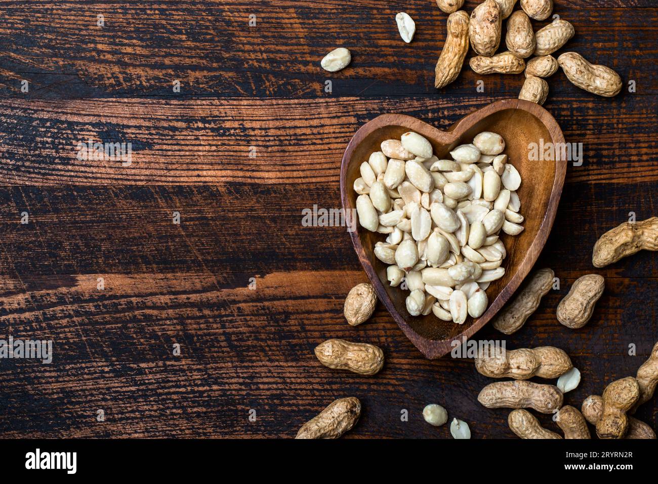 Peanuts snack in bowl on dark background Stock Photo