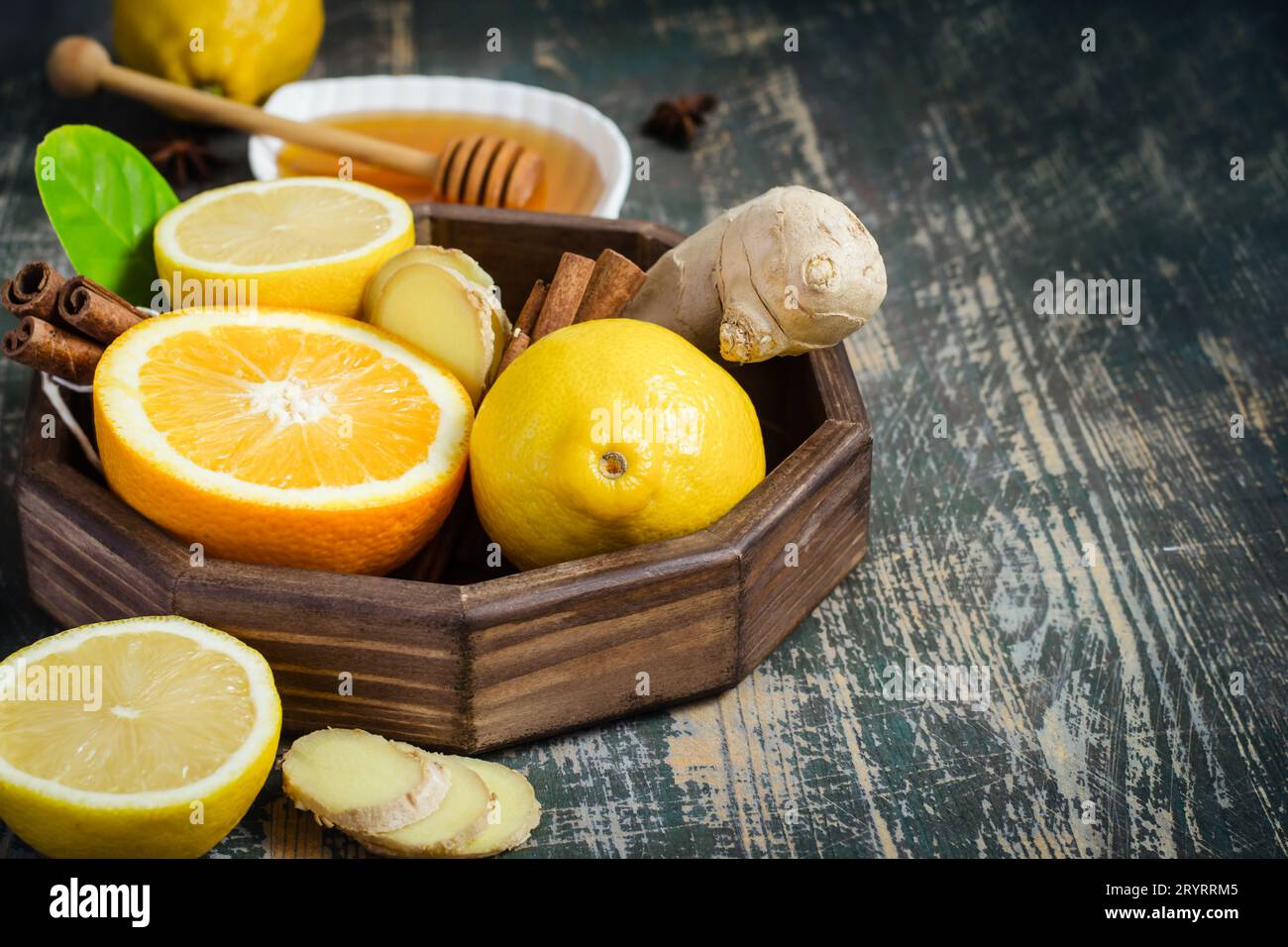 Tray with ingredients for making immunity boosting  healthy vitamin drink On dark background Stock Photo