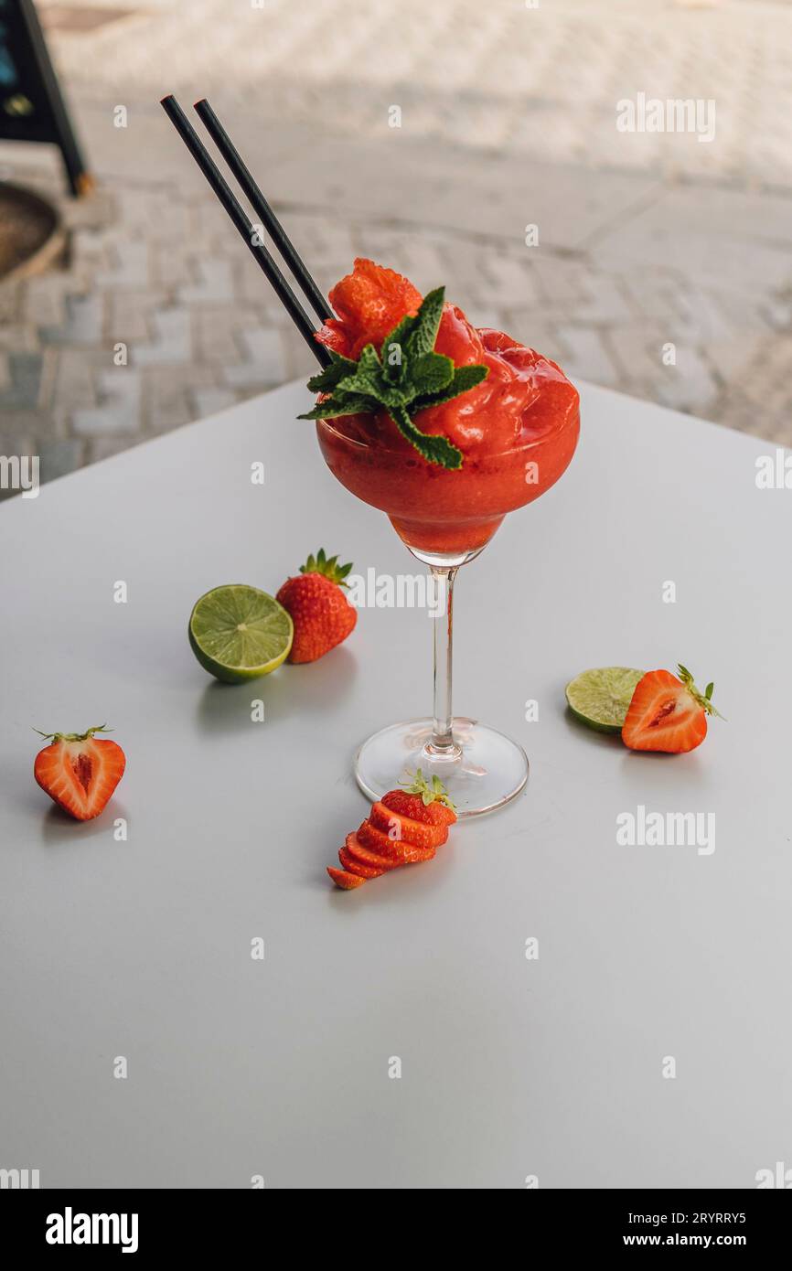 Strawberry Daiquiri Cocktail decorated with lime and strawberry fruit Stock Photo