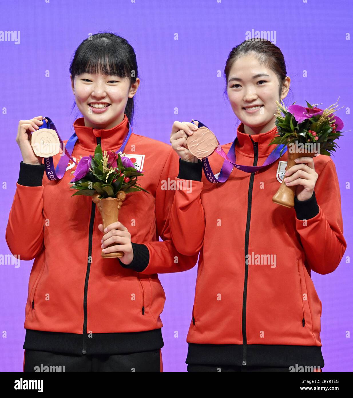 Japan's Miwa Harimoto (L) and Miyuu Kihara pose for a photo with their