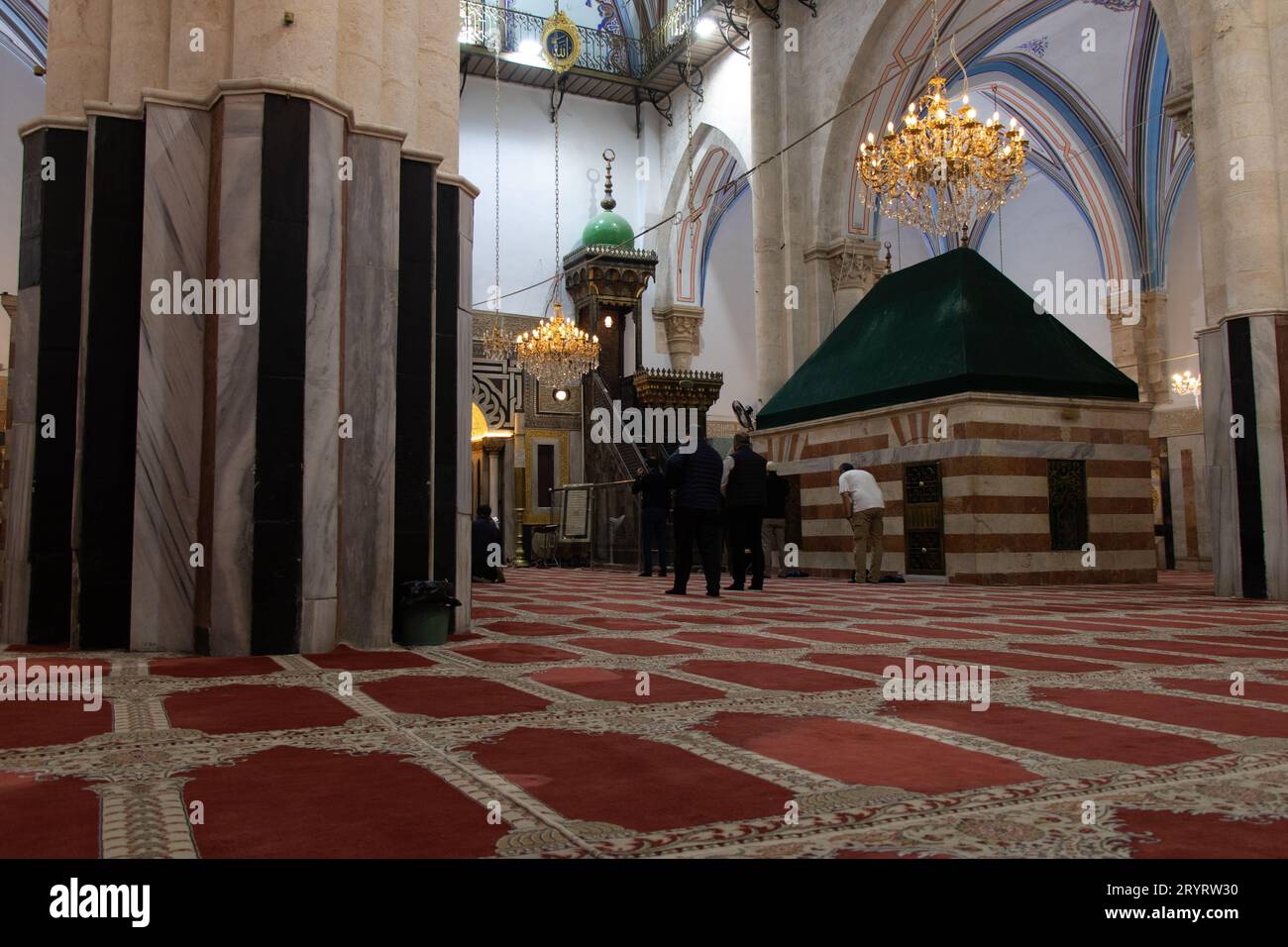 Cave of the Patriarchs in Hebron, Israel. 21 April 2022. Muslims praying near of the tomb of Isaac Prophet in the Cave of Machpelah Stock Photo