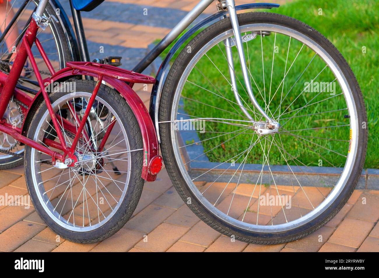Big and small bike. Bicycle transport.Large and small bicycle wheel ...