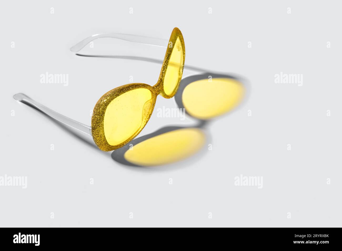 Trending colors of 2021. Plastic sunglasses with silver sparkles frame ...