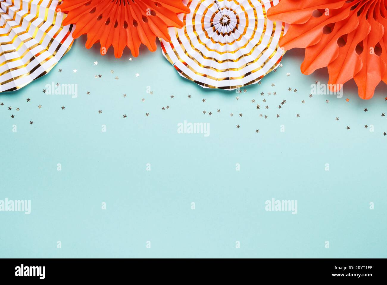 Holiday party background. Trendy Paper coral and gold decoration on turquoise background Stock Photo