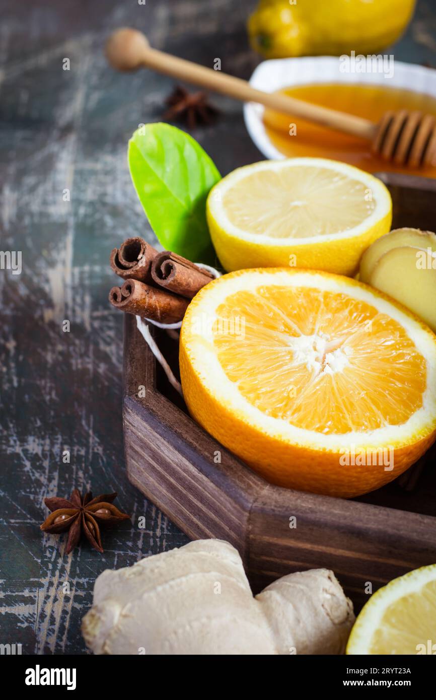 Tray with ingredients for making immunity boosting  healthy vitamin drink On dark background Stock Photo