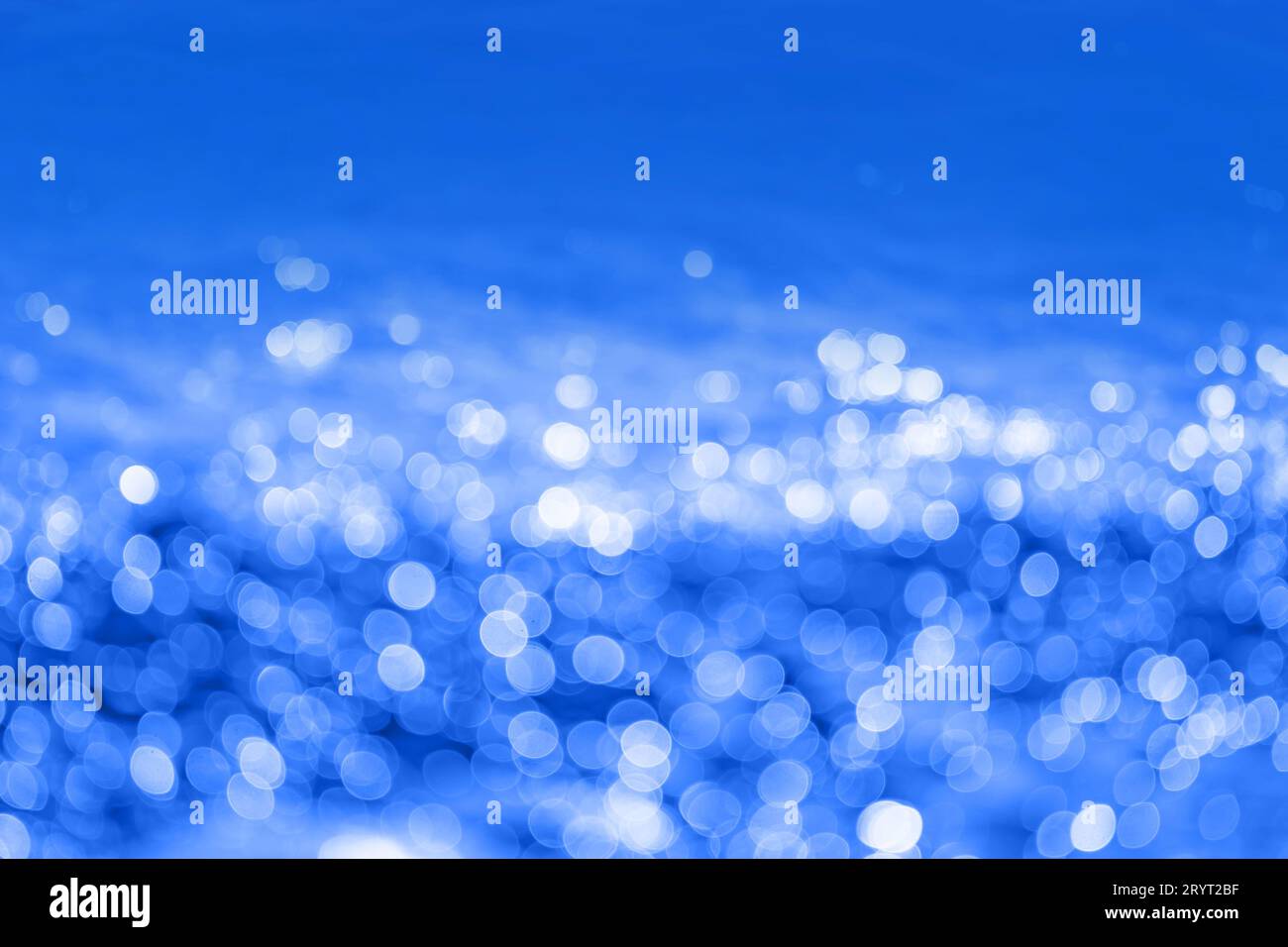 Abstract dark ink blue bokeh background. Defocused cobalt blue lights ...