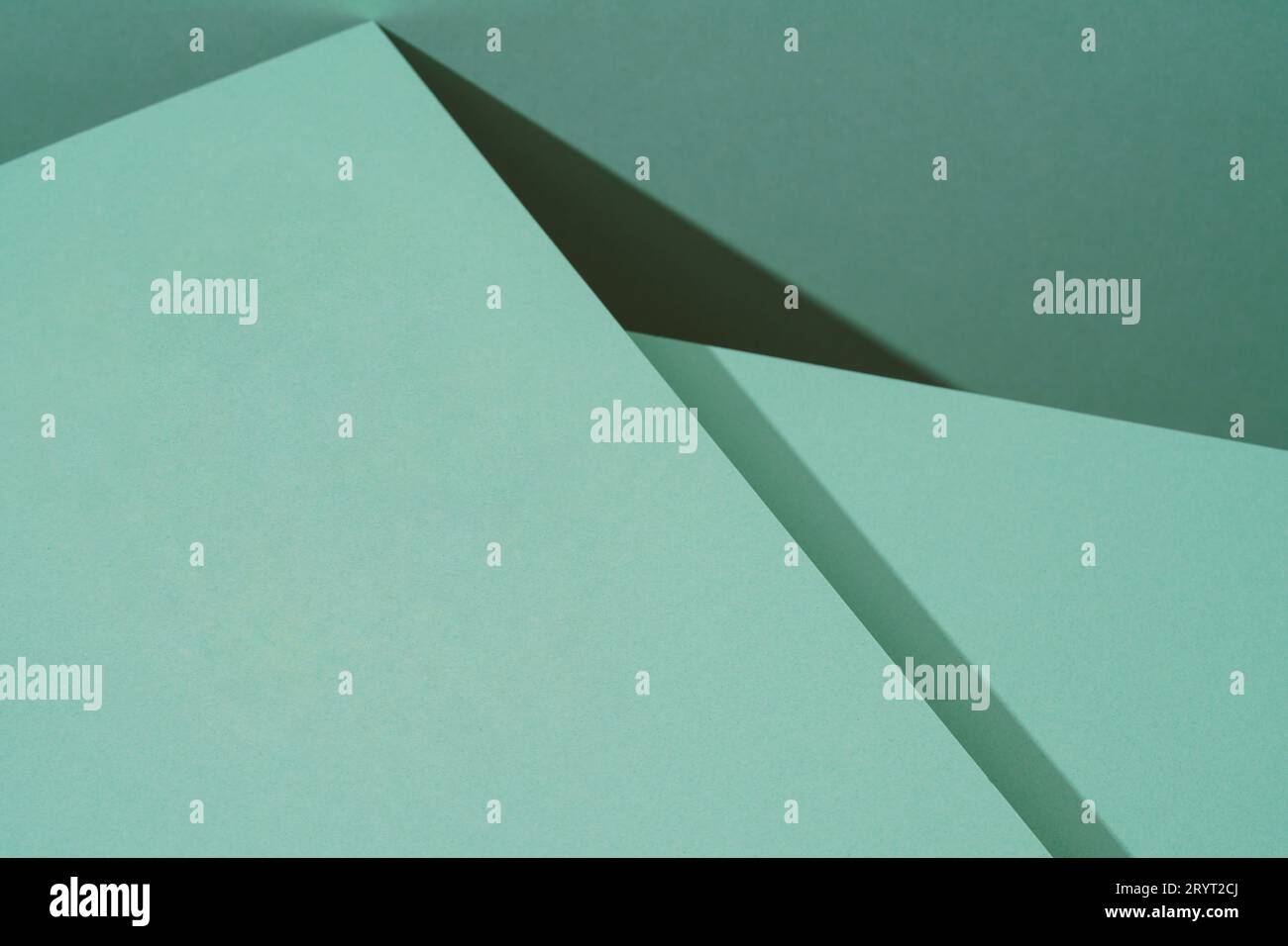 Colorful background from green paper with shadow. Abstract geometric Stock Photo