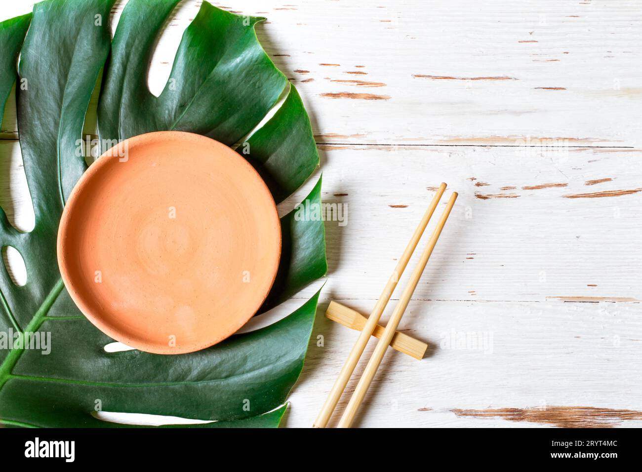 Table setting Chopstick and ceramic handmade dish. Asian food concept. Stock Photo