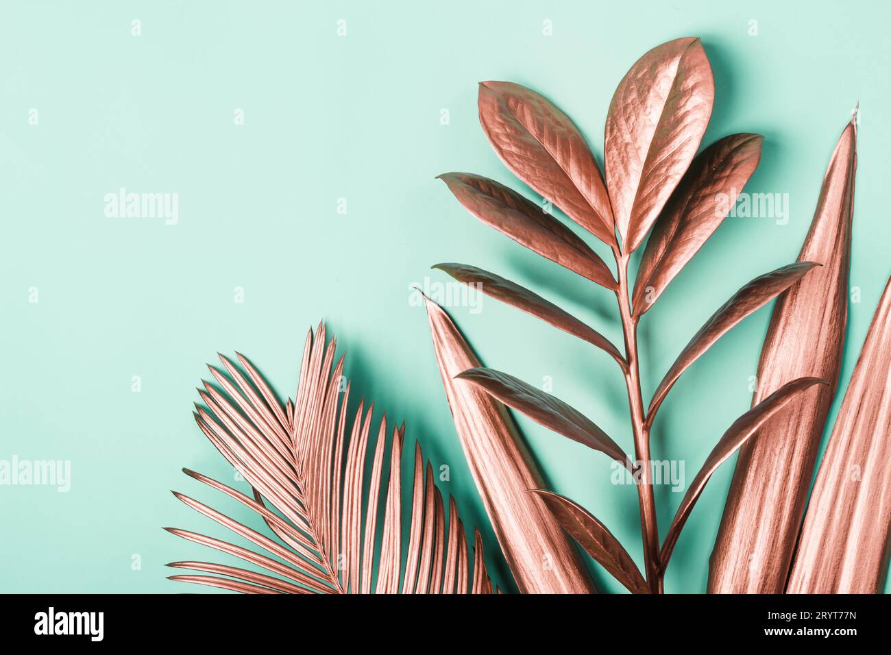 Natural Creative layout made of pink metallic tropical leaves. Minimal surrealism background Stock Photo