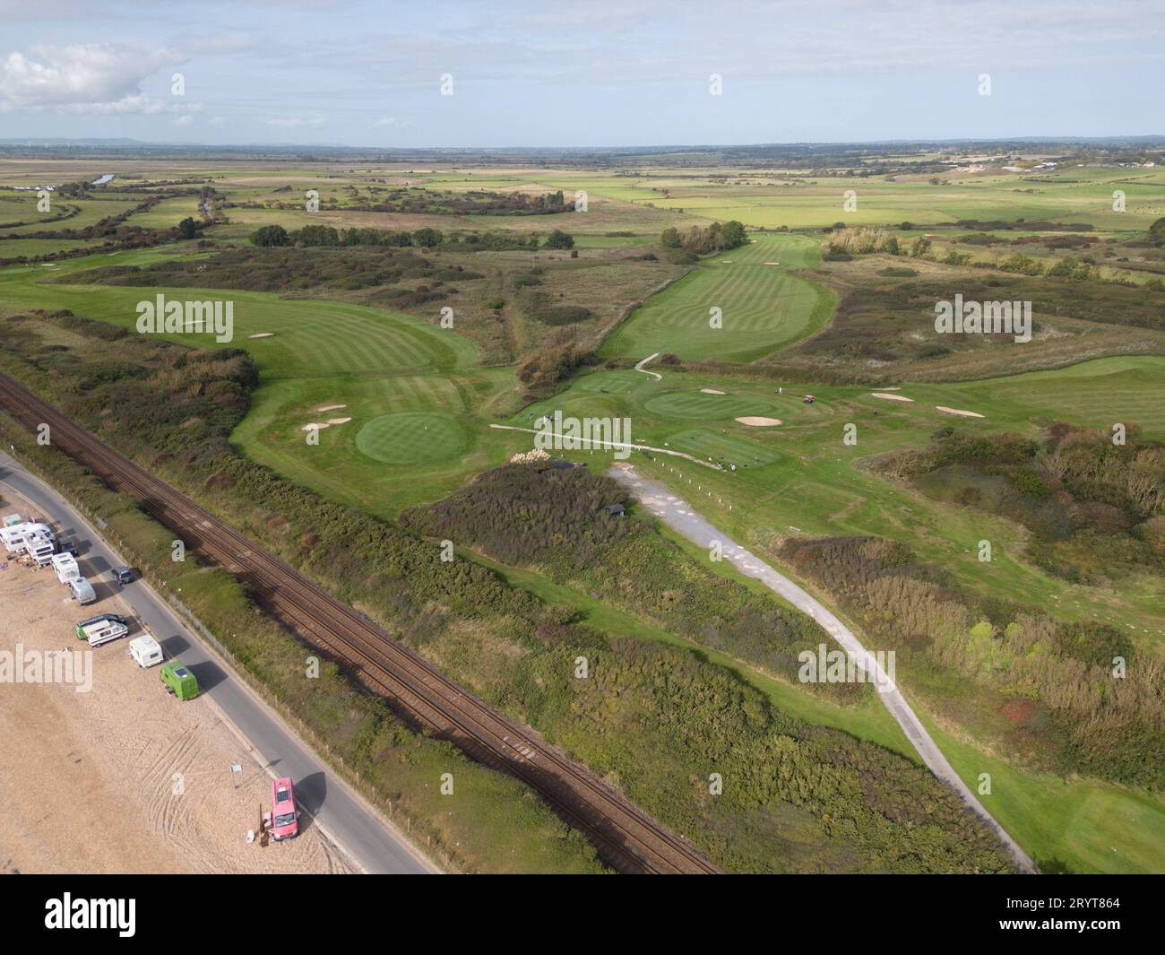 aerial view of the railway line and golf course along cooden beach in