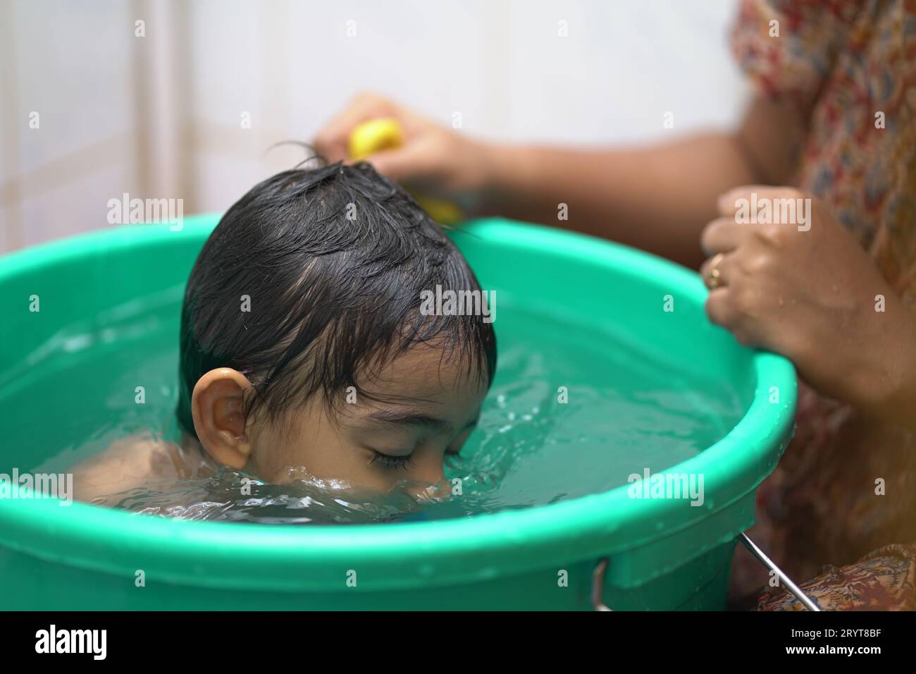 Asian boy bathing in bathtub hires stock photography and images Alamy