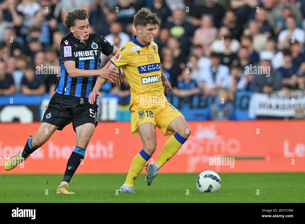 Maxim De Cuyper (55) of Club Brugge fighting for the ball with Jarne  Steuckers (18) of STVV during the Jupiler Pro League season 2023 - 2024  match day 9 between Club Brugge