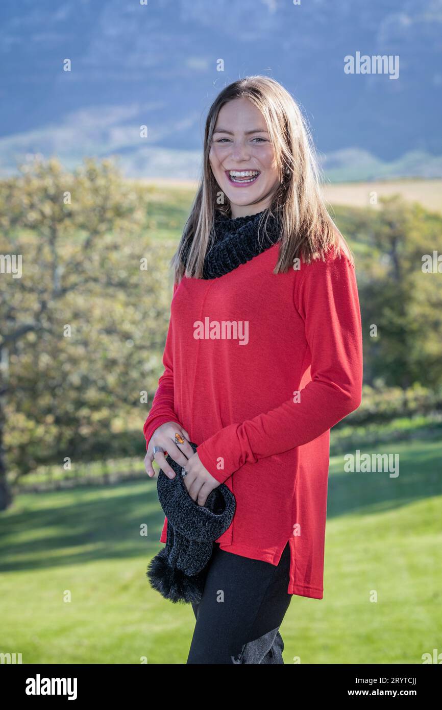 Woman wearing red sweater hi-res stock photography and images - Alamy