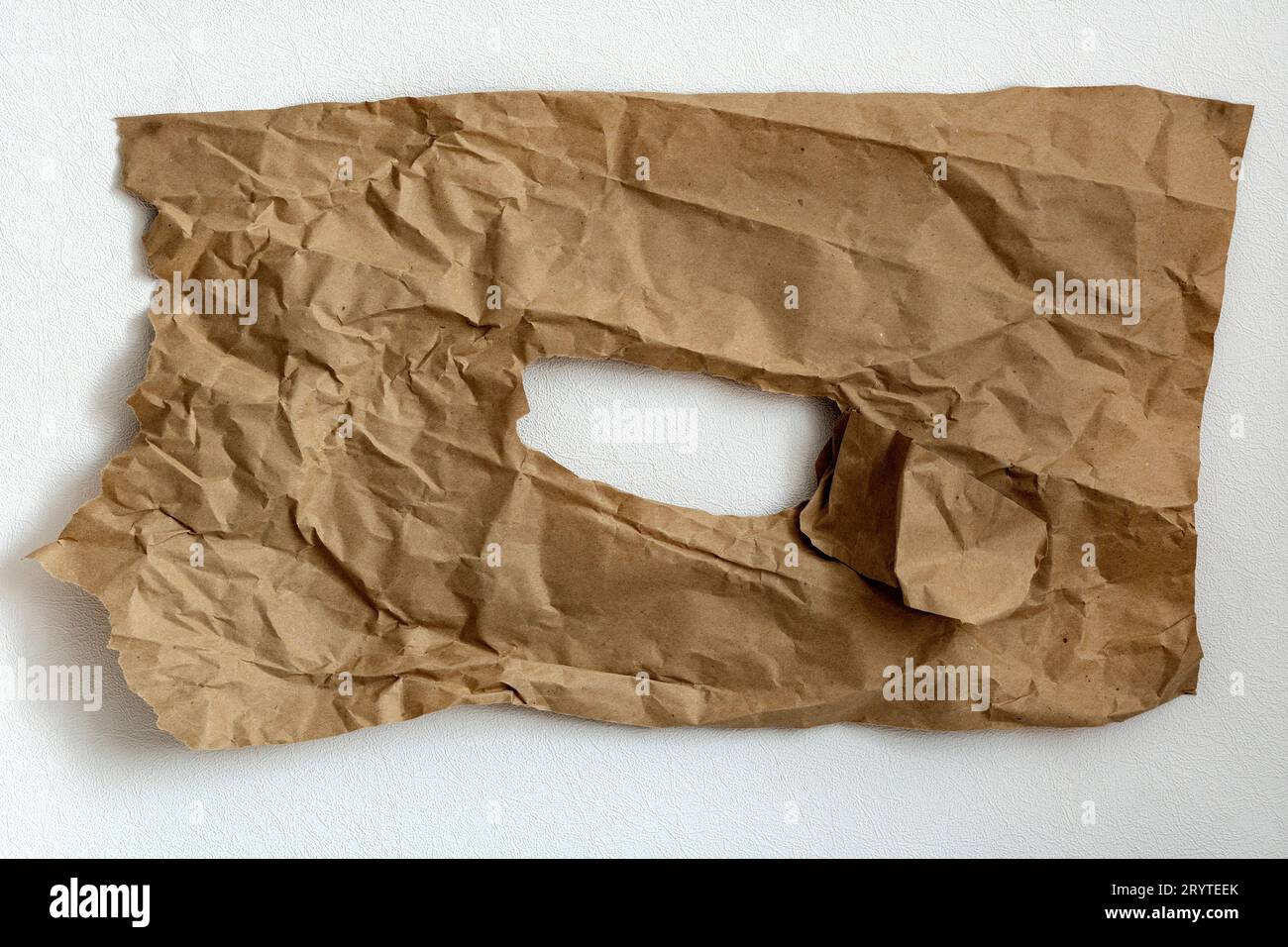 hole in paper with color paper background inside. Good paper texture