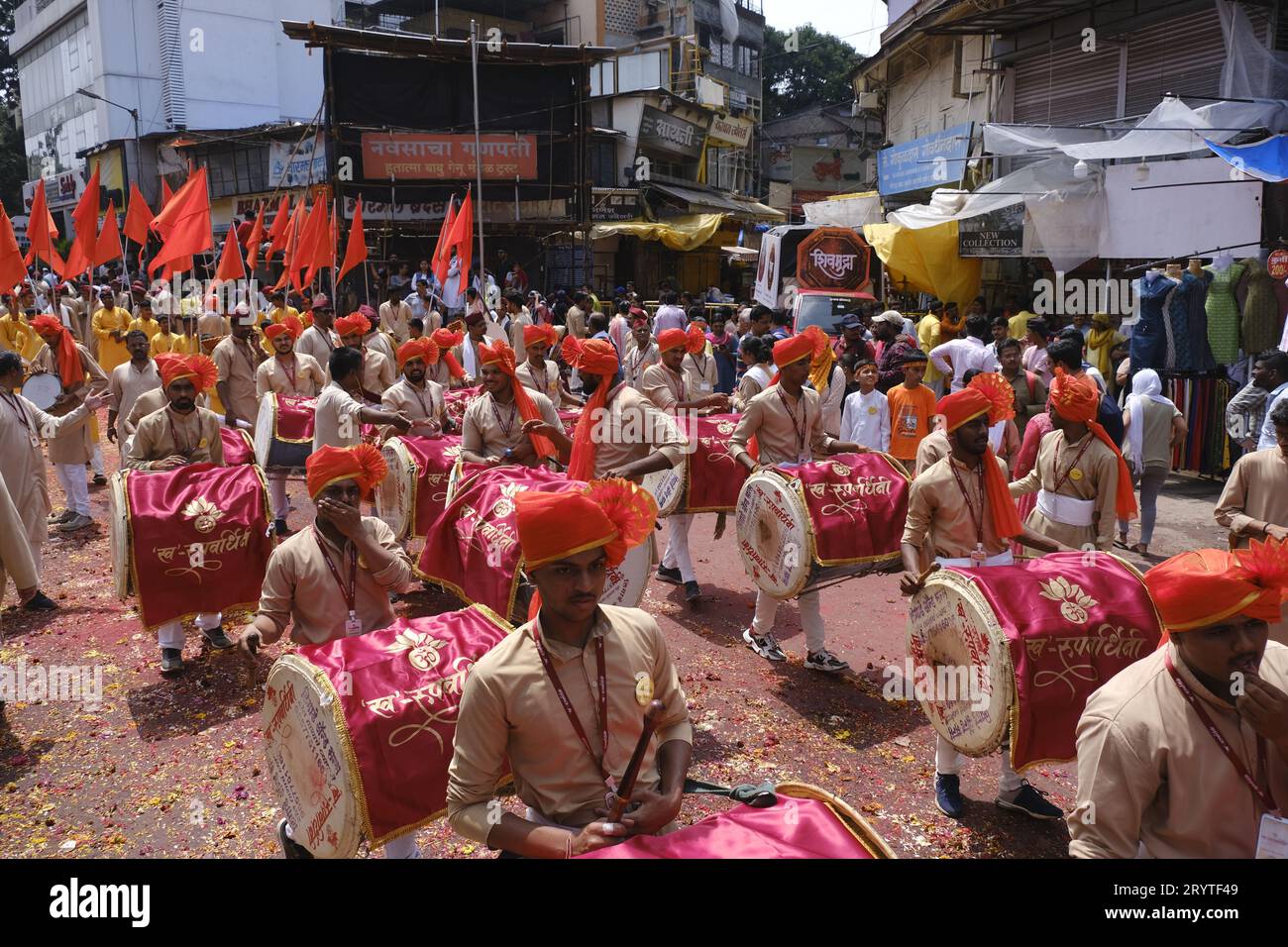 Pune, India - September 29, 2023, Ganesh immersion procession, Dhol tasha pathak playing traditional dhol on the streets of pune in Ganesh Festival. Stock Photo