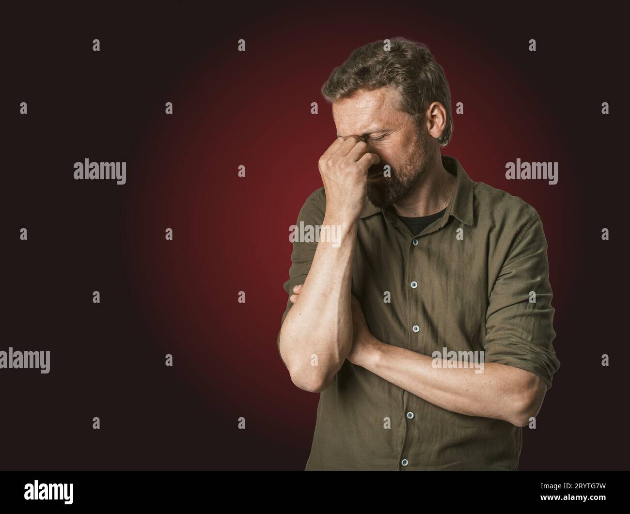 Man facing personal problems and challenges. Mid-aged man with closed eyes, conveying sense of sadness and inner turmoil. Isolat Stock Photo