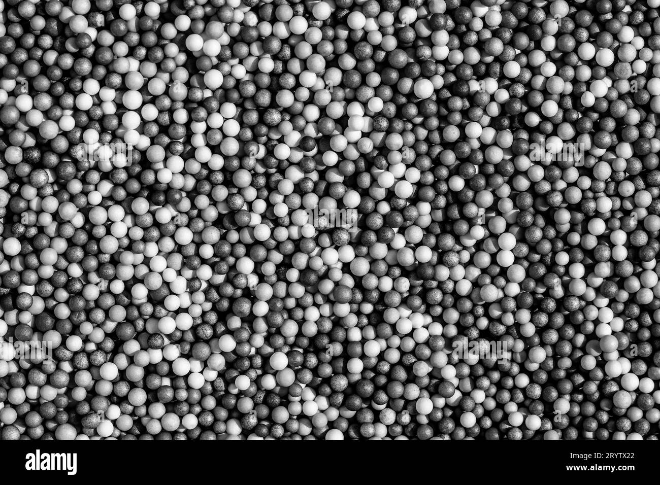 Many different colored small balls Black and White Stock Photos ...