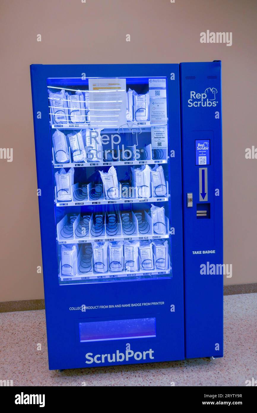 Nurging scrubs for sale in a dispensing machine outside a medical facility entrance in a North Florida shopping mall. Stock Photo