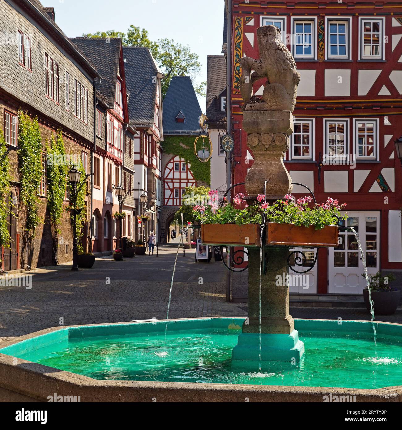 Market fountain at Buttermarkt in front of half-timbered house, Herborn, Hesse, Germany, Europe Stock Photo