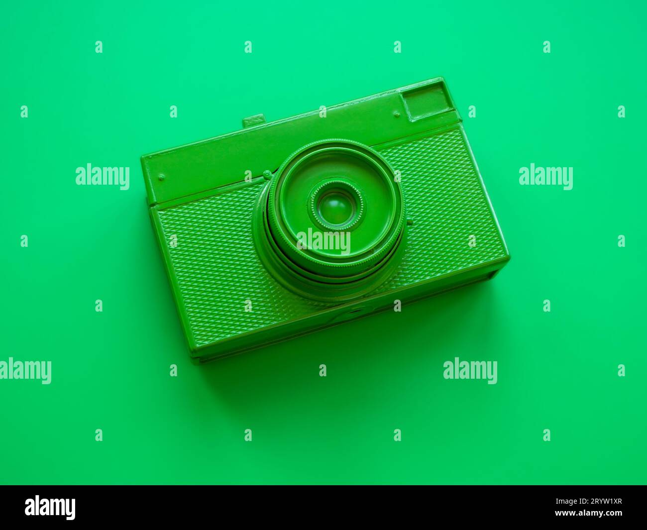 Top view of green film camera. Minimal trendy style. Stock Photo